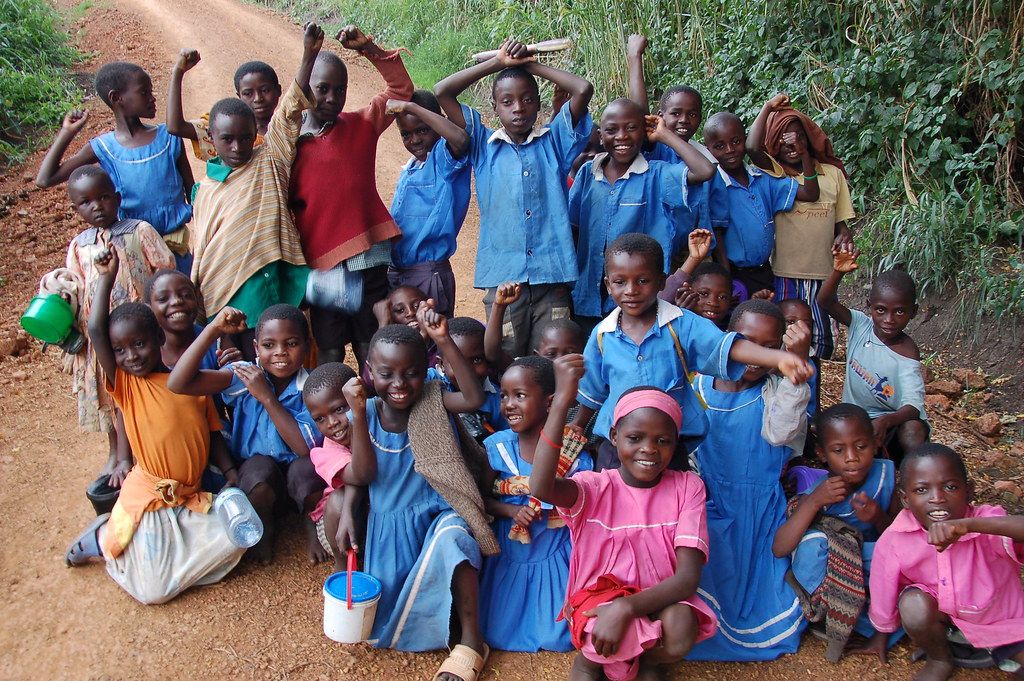 A large group of cheerful schoolchildren in Africa